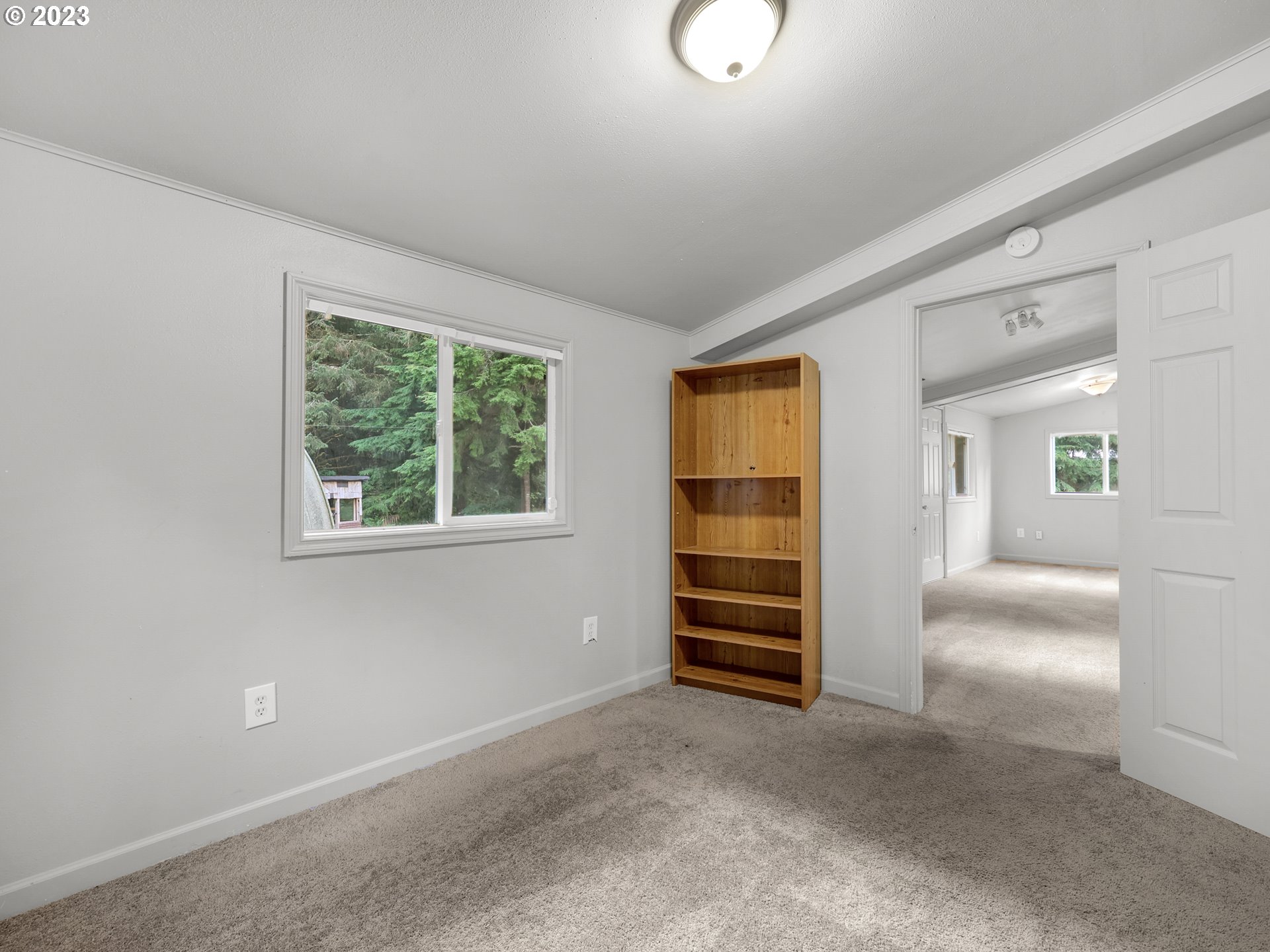 92287 Walluski Loop Astoria, OR 97103 - Photo 33 of 39 an empty room with furniture and windows