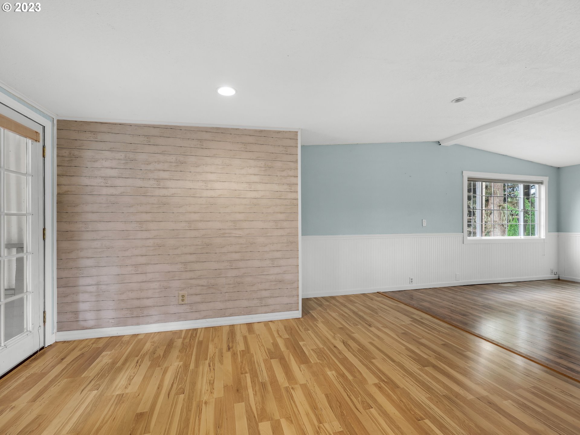 92287 Walluski Loop Astoria, OR 97103 - Photo 10 of 39 wooden floor in an empty room with a window
