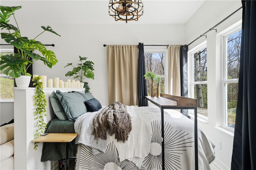 710 Lumber Company Road Talking Rock, GA 30175 - Photo 13 of 27 a view of a balcony with furniture and a potted plant