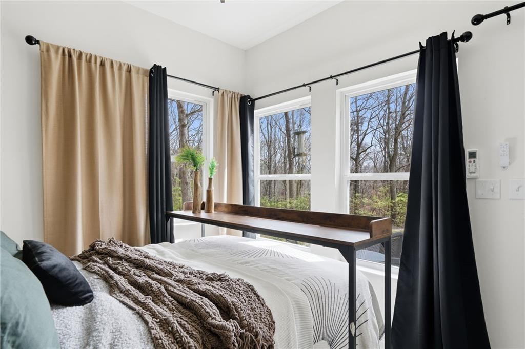 710 Lumber Company Road Talking Rock, GA 30175 - Photo 14 of 27 a bedroom with a bed and a window