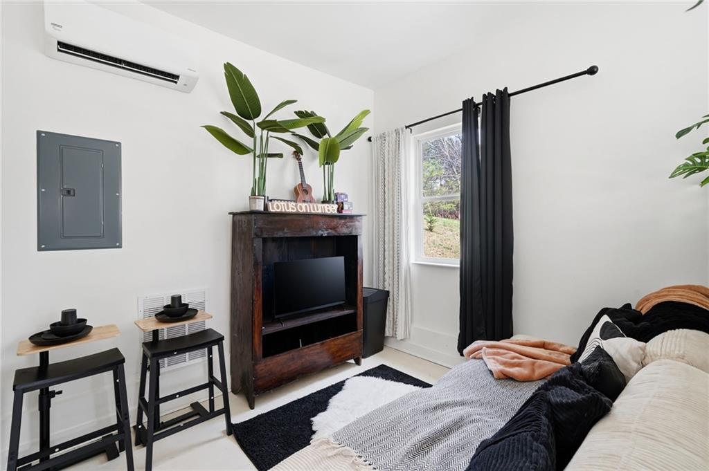 710 Lumber Company Road Talking Rock, GA 30175 - Photo 15 of 27 a bedroom with a bed and a television