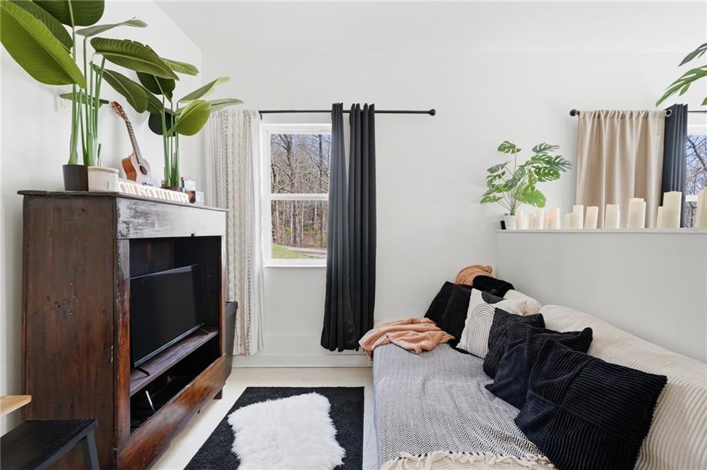 710 Lumber Company Road Talking Rock, GA 30175 - Photo 16 of 27 a living room with furniture and a potted plant