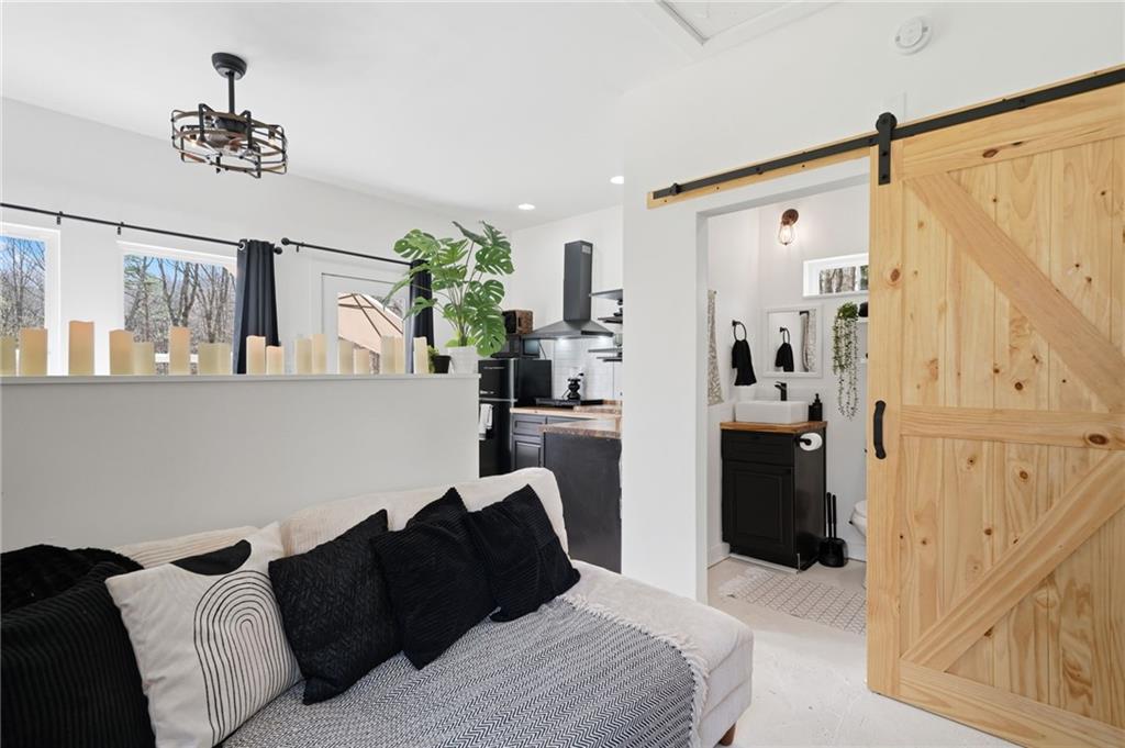 710 Lumber Company Road Talking Rock, GA 30175 - Photo 17 of 27 a bedroom with a bed and a couch