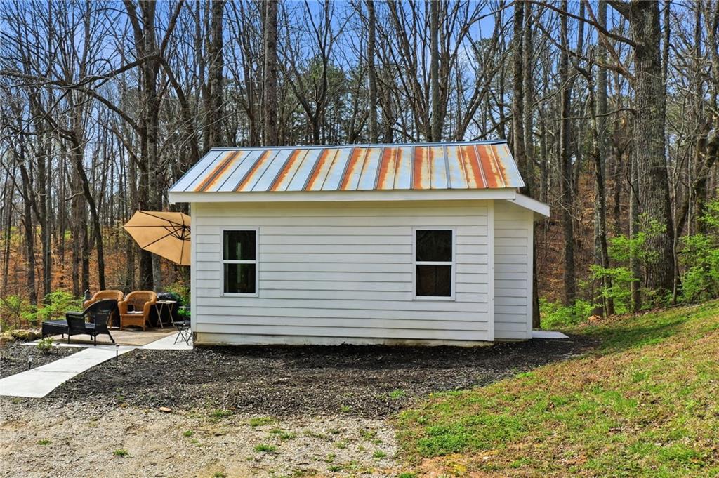 710 Lumber Company Road Talking Rock, GA 30175 - Photo 21 of 27 a view of a back yard of the house