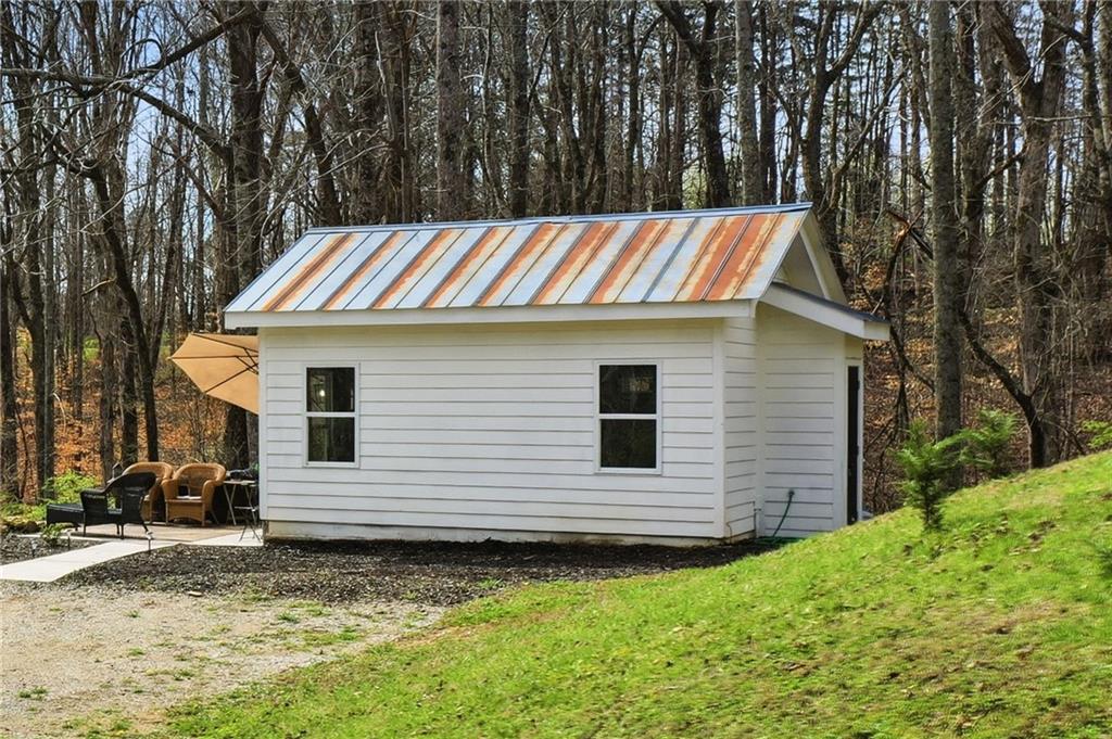 710 Lumber Company Road Talking Rock, GA 30175 - Photo 22 of 27 a view of a house with a backyard