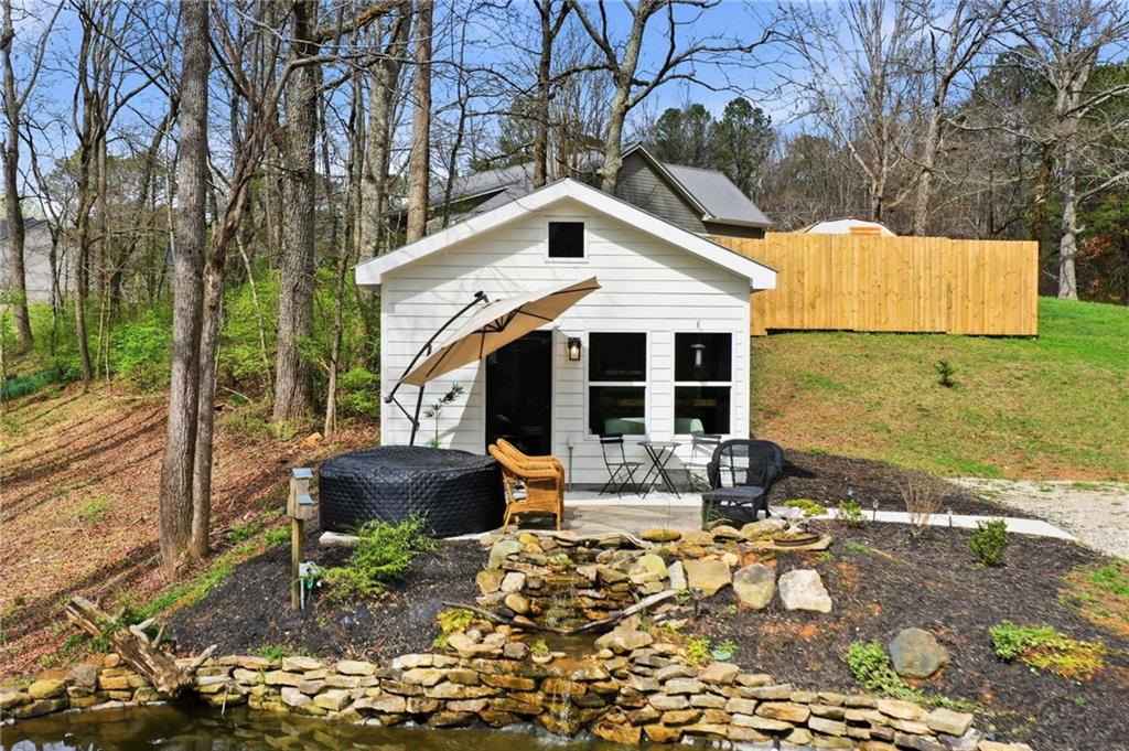 710 Lumber Company Road Talking Rock, GA 30175 - Photo 3 of 27 a front view of a house with sitting area