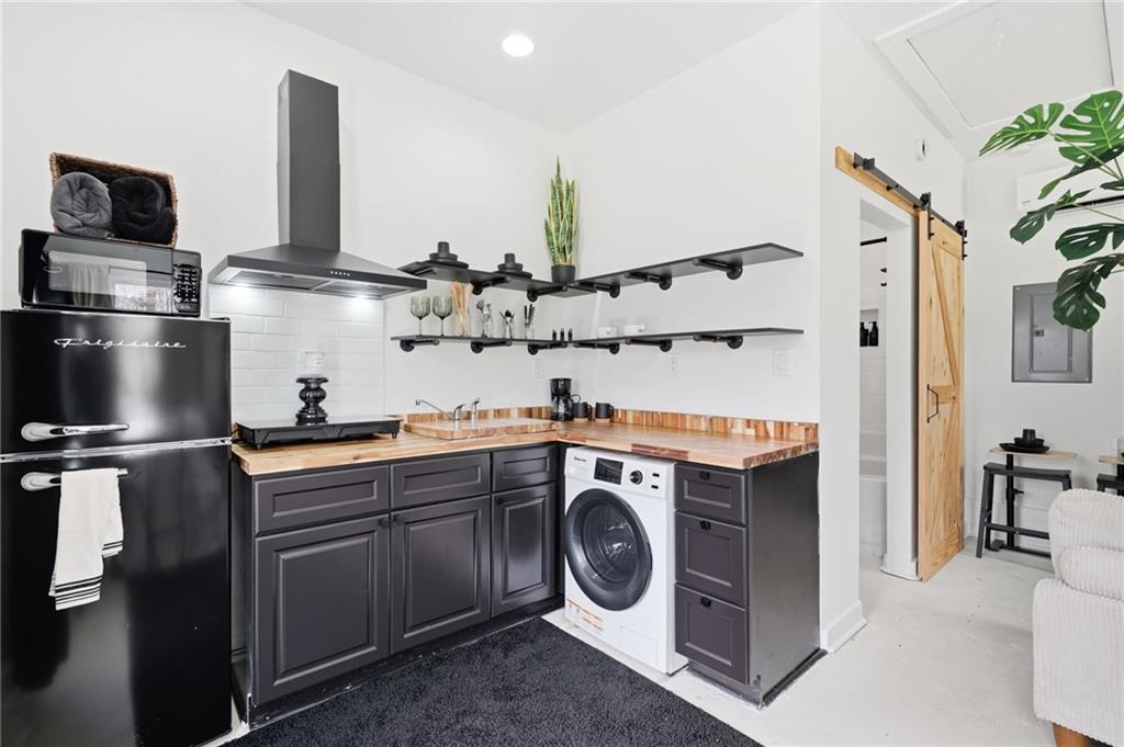 710 Lumber Company Road Talking Rock, GA 30175 - Photo 6 of 27 a kitchen with stainless steel appliances granite countertop a sink and a stove top oven