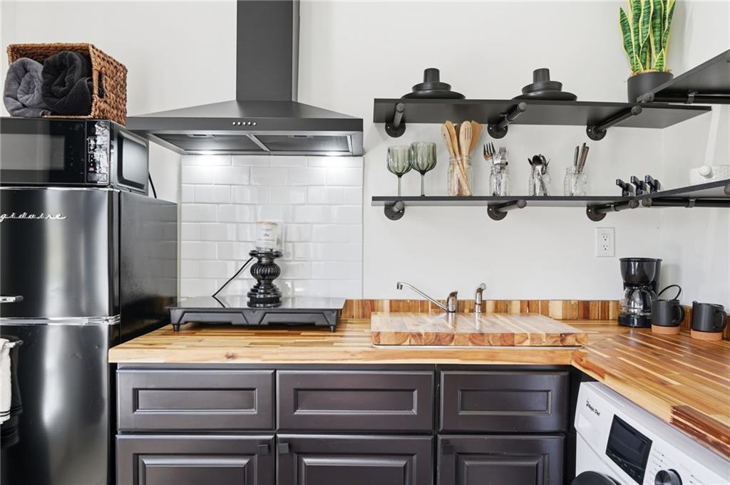 710 Lumber Company Road Talking Rock, GA 30175 - Photo 8 of 27 a kitchen with stainless steel appliances granite countertop a sink and cabinets