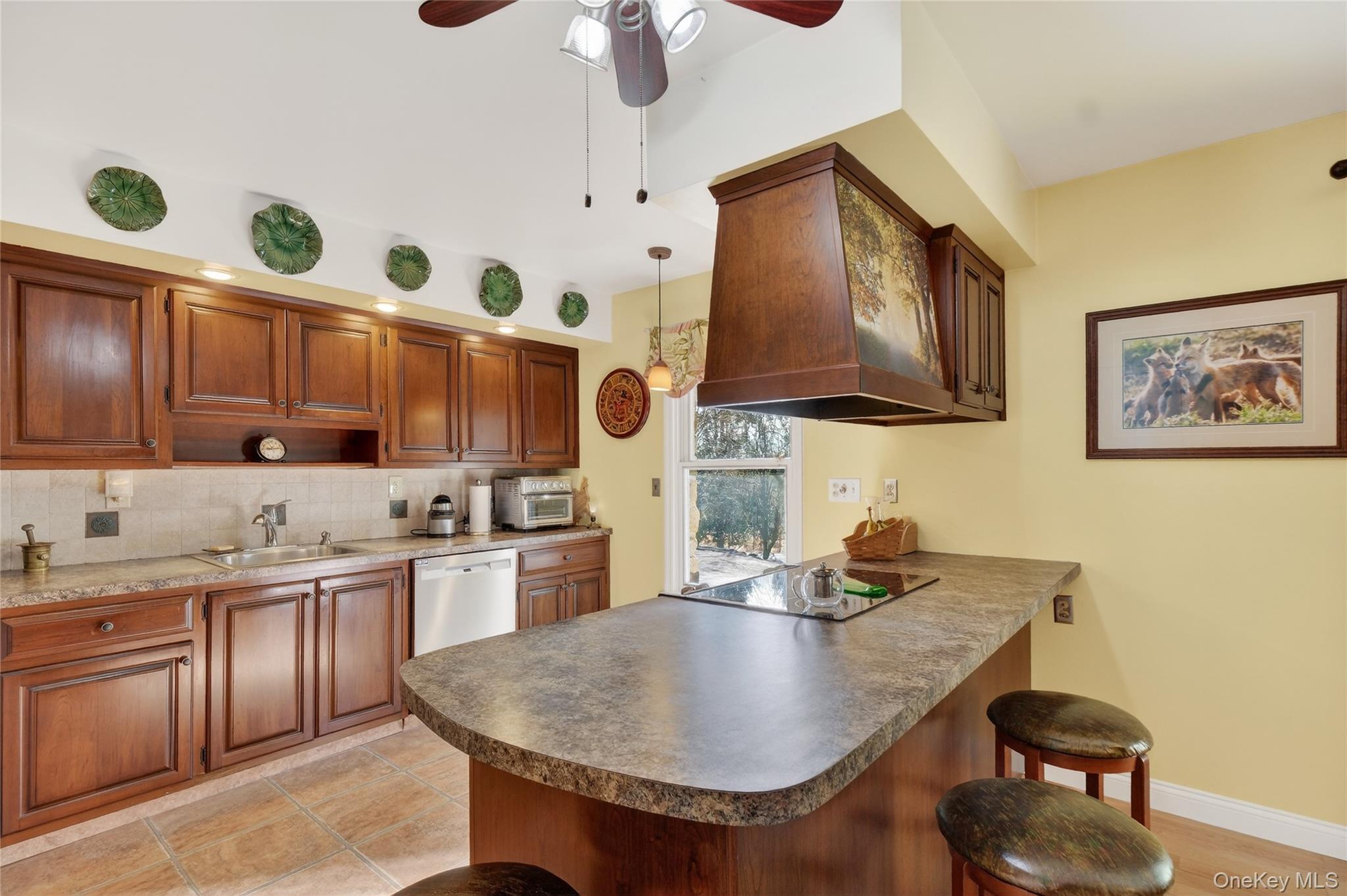 123 Fleury Road Pine Bush, NY 12566 - Photo 11 of 46 Kitchen with a breakfast bar area, a peninsula, pendant lighting, and wood finish cabinets