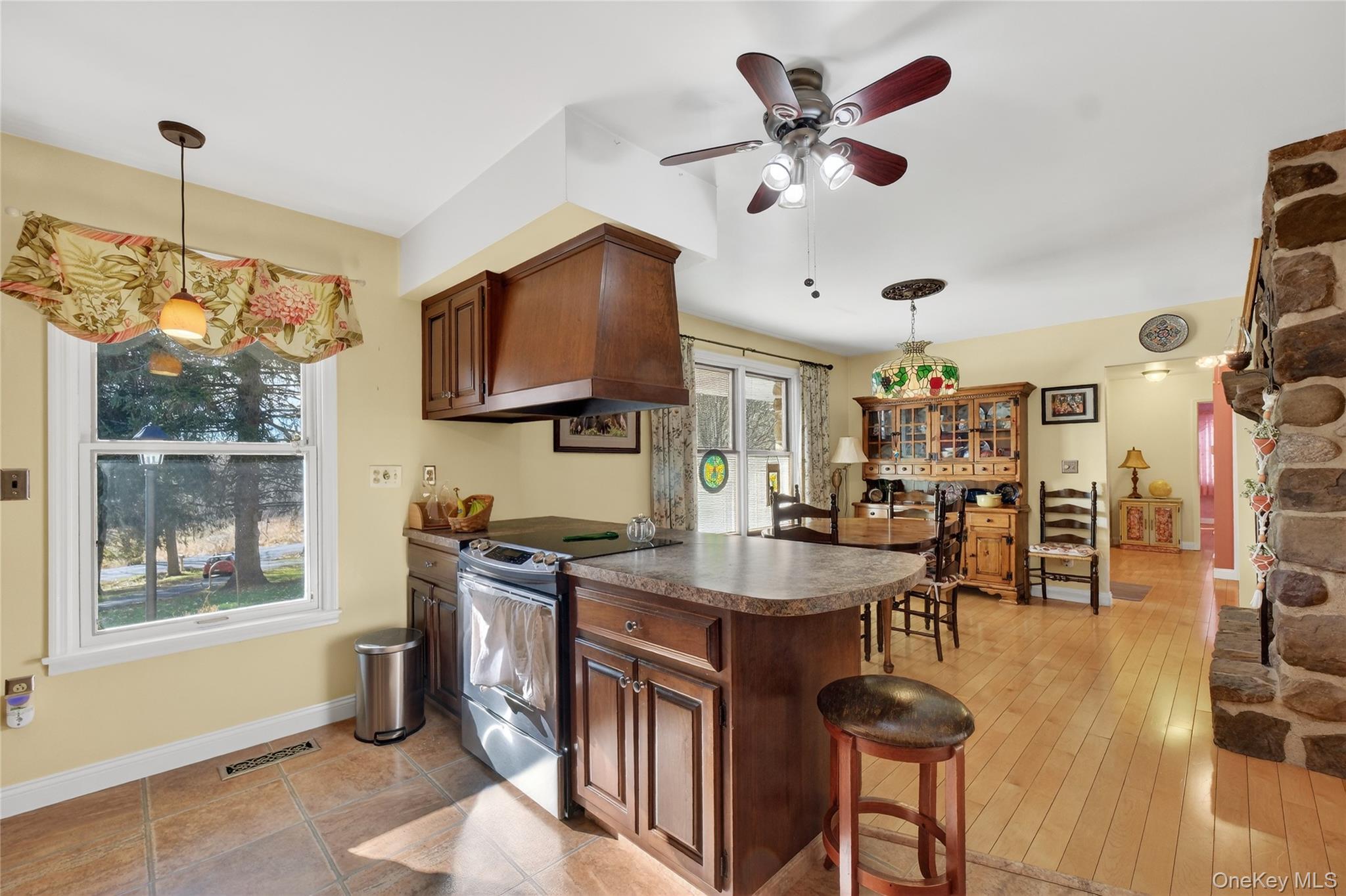 123 Fleury Road Pine Bush, NY 12566 - Photo 15 of 46 Kitchen featuring stainless steel electric range, a peninsula, dark countertops, and pendant lighting