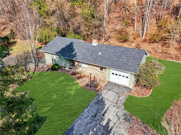 a view of an house with backyard space and garden