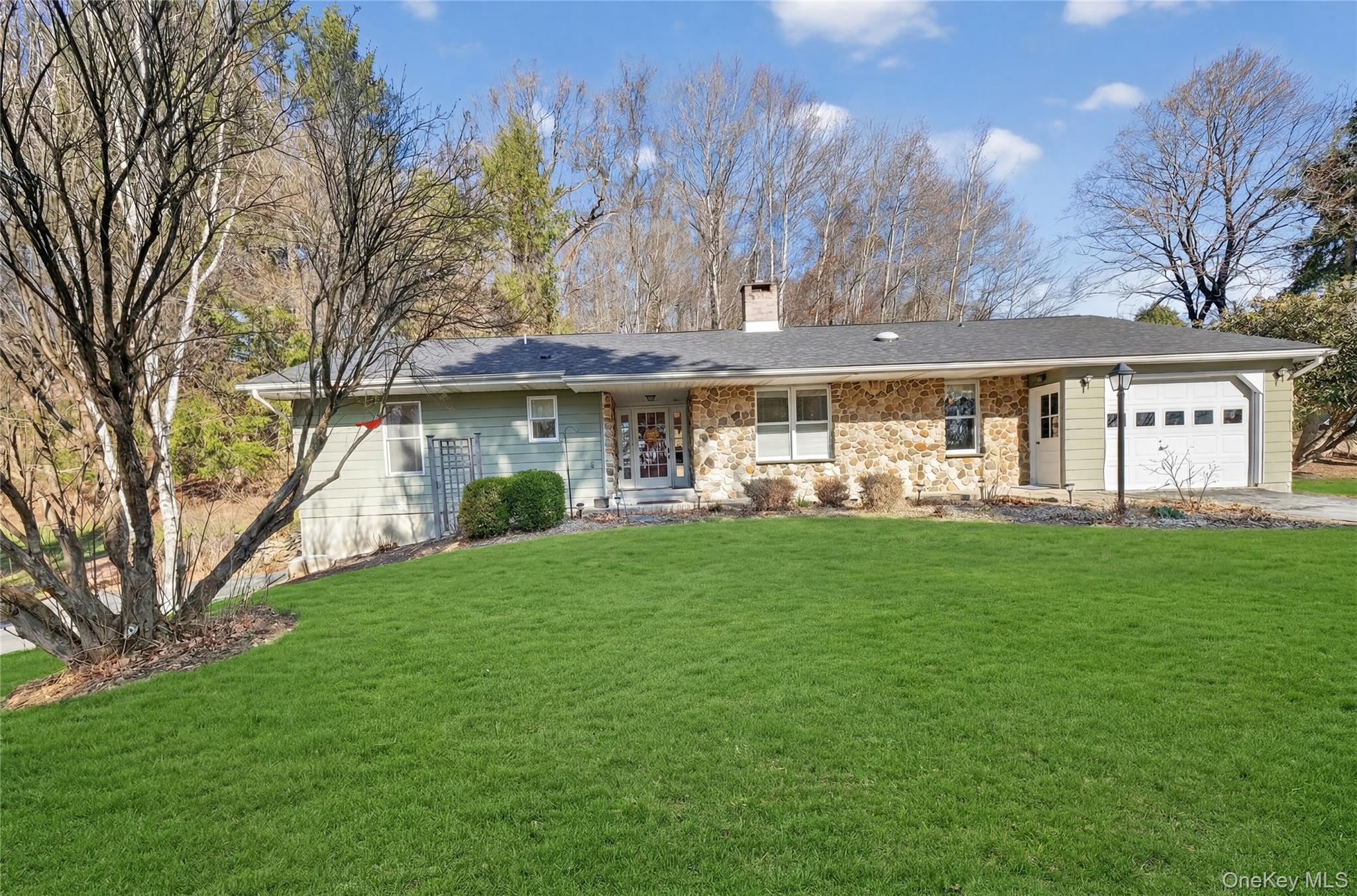 123 Fleury Road Pine Bush, NY 12566 - Photo 3 of 46 Ranch-style home with a garage, a front lawn, a chimney, covered porch, and driveway