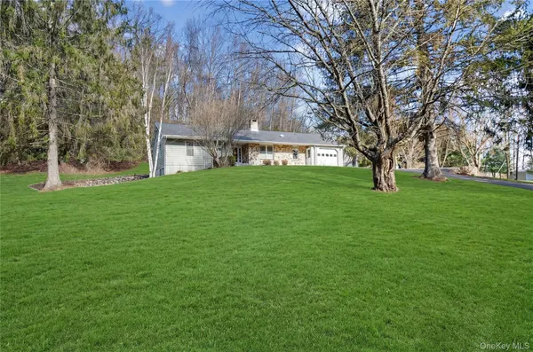 a view of house with yard