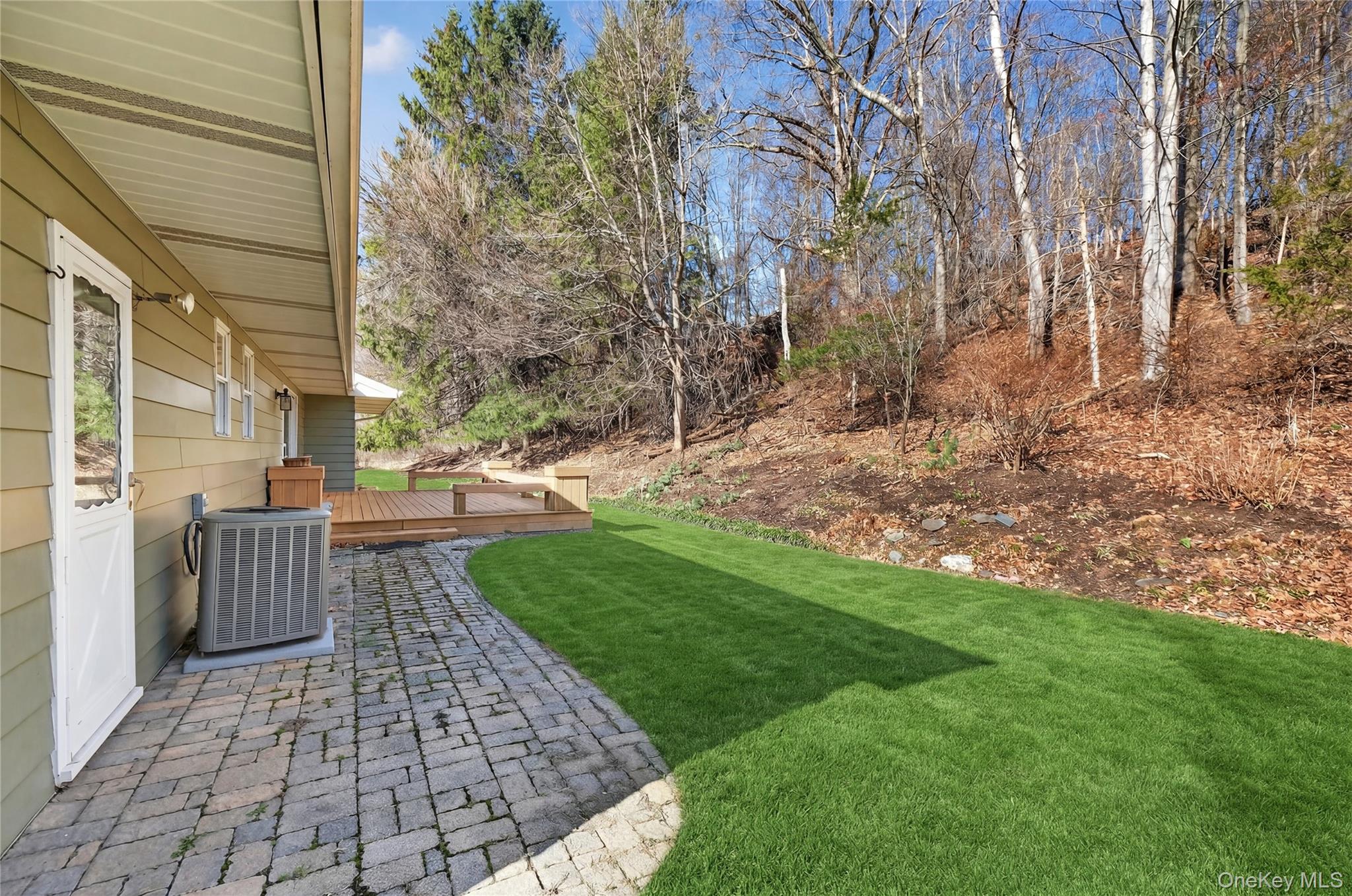 123 Fleury Road Pine Bush, NY 12566 - Photo 9 of 46 View of grassy yard featuring a wooden deck and a patio