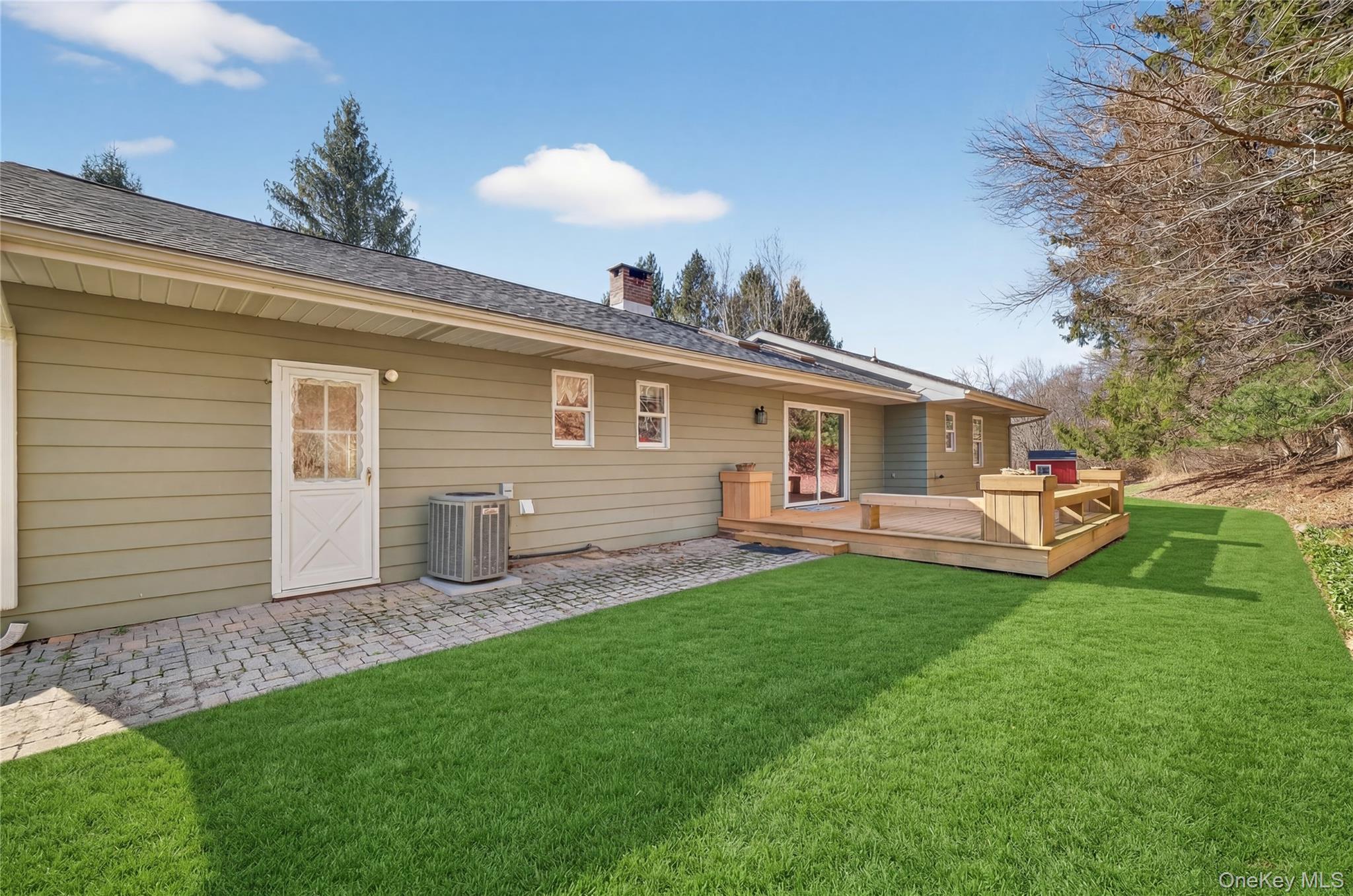 123 Fleury Road Pine Bush, NY 12566 - Photo 10 of 46 Back of property featuring a deck, a yard, a chimney, and a shingled roof