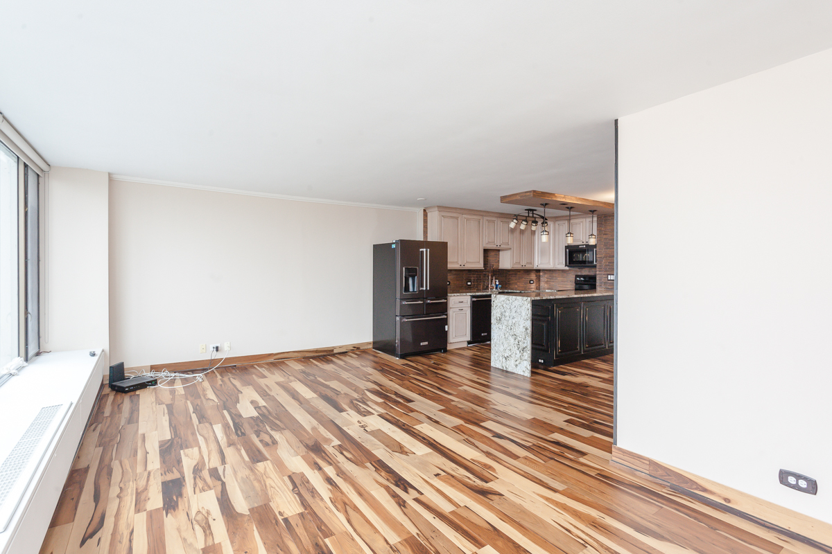 5455 North Sheridan Road, Unit 3307 Chicago, IL 60640 - Photo 12 of 21 a view of a kitchen with wooden floor