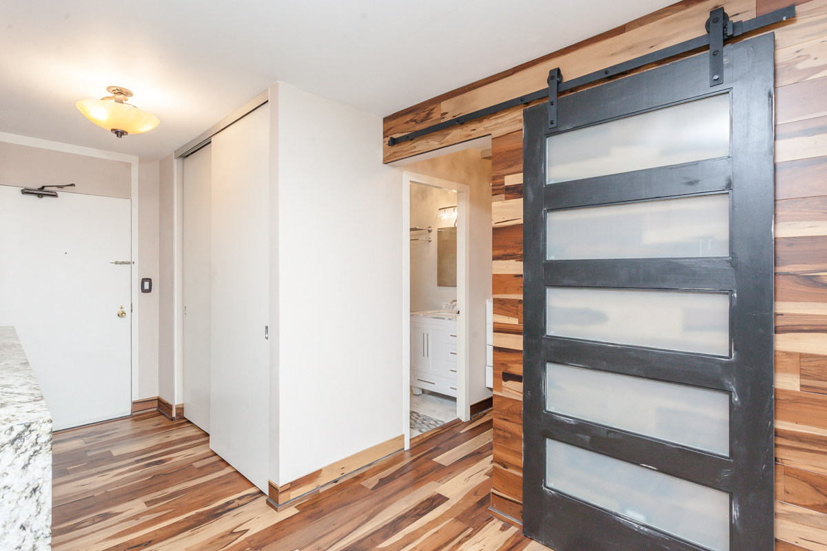 5455 North Sheridan Road, Unit 3307 Chicago, IL 60640 - Photo 15 of 21 a view of an empty room with wooden floor and a window