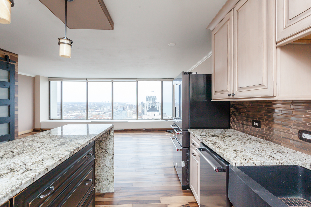 5455 North Sheridan Road, Unit 3307 Chicago, IL 60640 - Photo 7 of 21 a kitchen with a stove and a sink