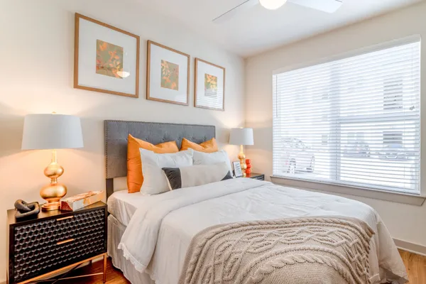 a bedroom with a bed and window