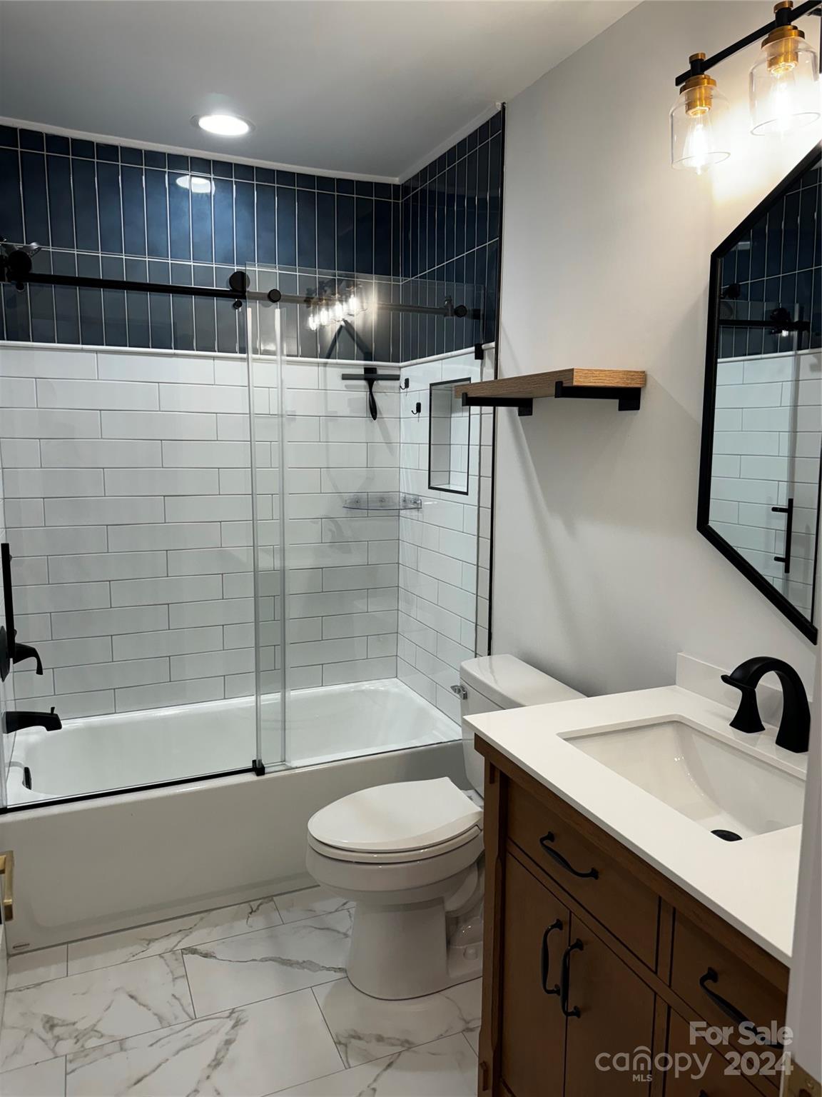 63 Ridgeport Road Clover, SC 29710 - Photo 6 of 7 a bathroom with a sink a toilet and shower