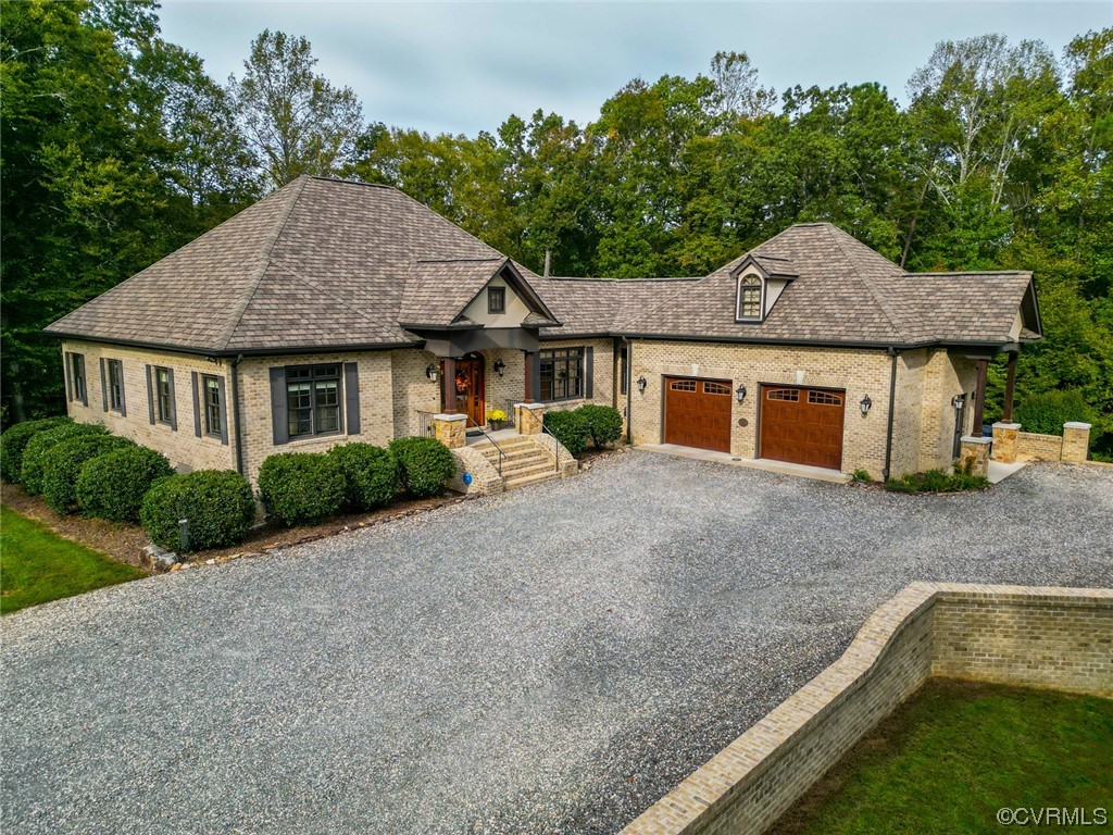 14440 Yankeetown Road Ashland, VA 23005 - Photo 2 of 50 a front view of a house with a garden and yard