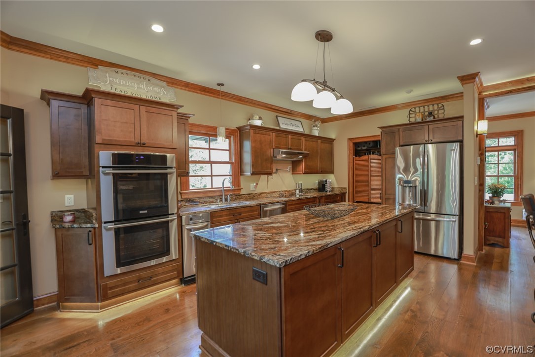 14440 Yankeetown Road Ashland, VA 23005 - Photo 23 of 50 a kitchen with stainless steel appliances granite countertop a stove refrigerator and microwave