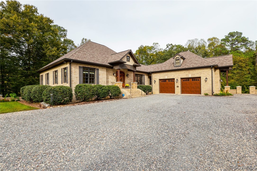 14440 Yankeetown Road Ashland, VA 23005 - Photo 4 of 50 a front view of a house with a yard and garage