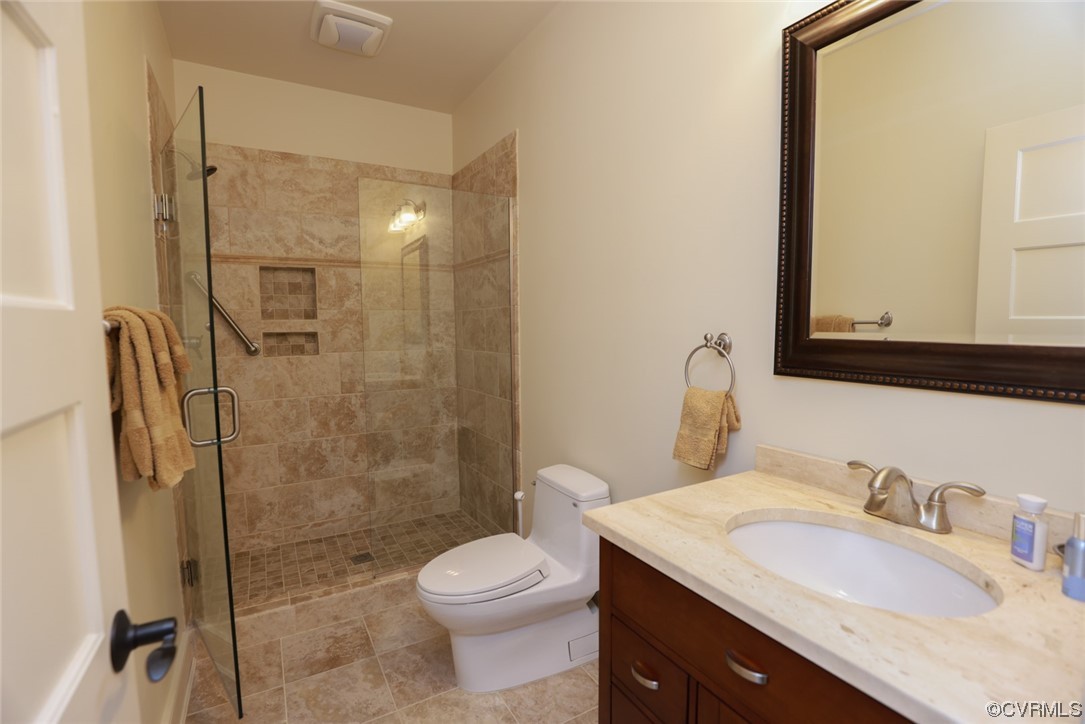 14440 Yankeetown Road Ashland, VA 23005 - Photo 44 of 50 a bathroom with a granite countertop sink toilet and shower
