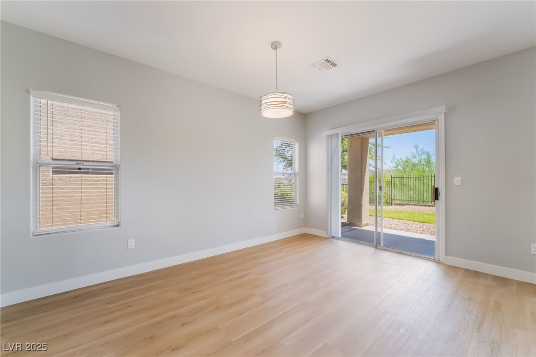 1442 Fieldbrook Street Henderson, NV 89052 - Photo 13 of 36 Empty room with baseboards and light wood finished floors