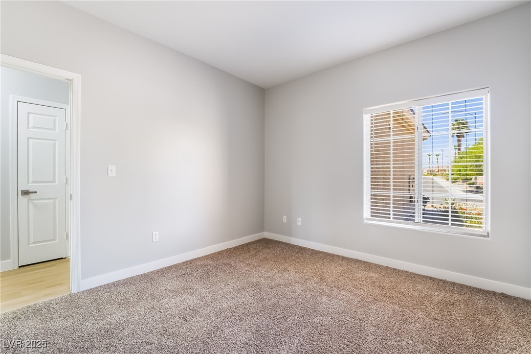 1442 Fieldbrook Street Henderson, NV 89052 - Photo 29 of 36 Empty room featuring baseboards and light colored carpet