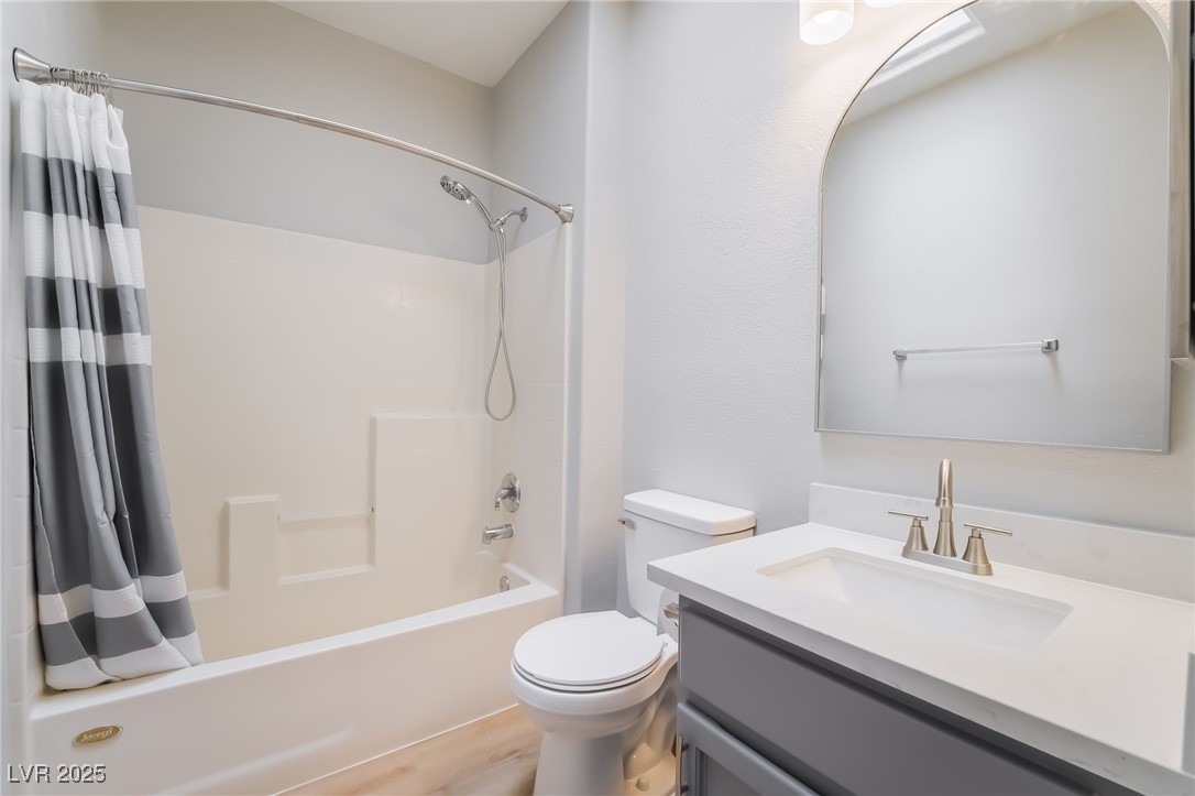 1442 Fieldbrook Street Henderson, NV 89052 - Photo 31 of 36 Bathroom featuring vanity, shower / bath combo with shower curtain, and light wood-type flooring