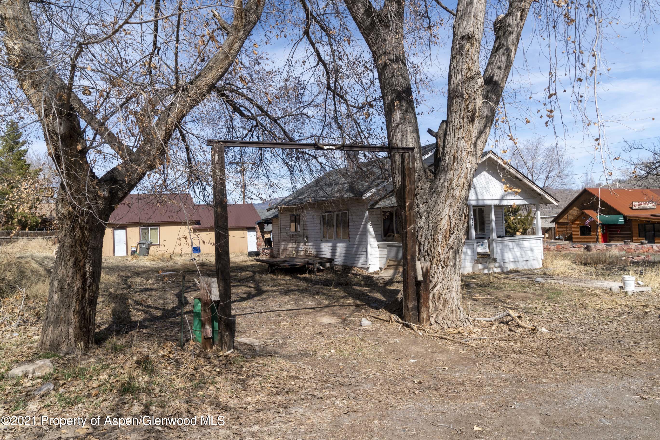 422 West 4th Street Rifle, CO 81650 - Photo 2 of 10 a view of a house with a yard covered in snow