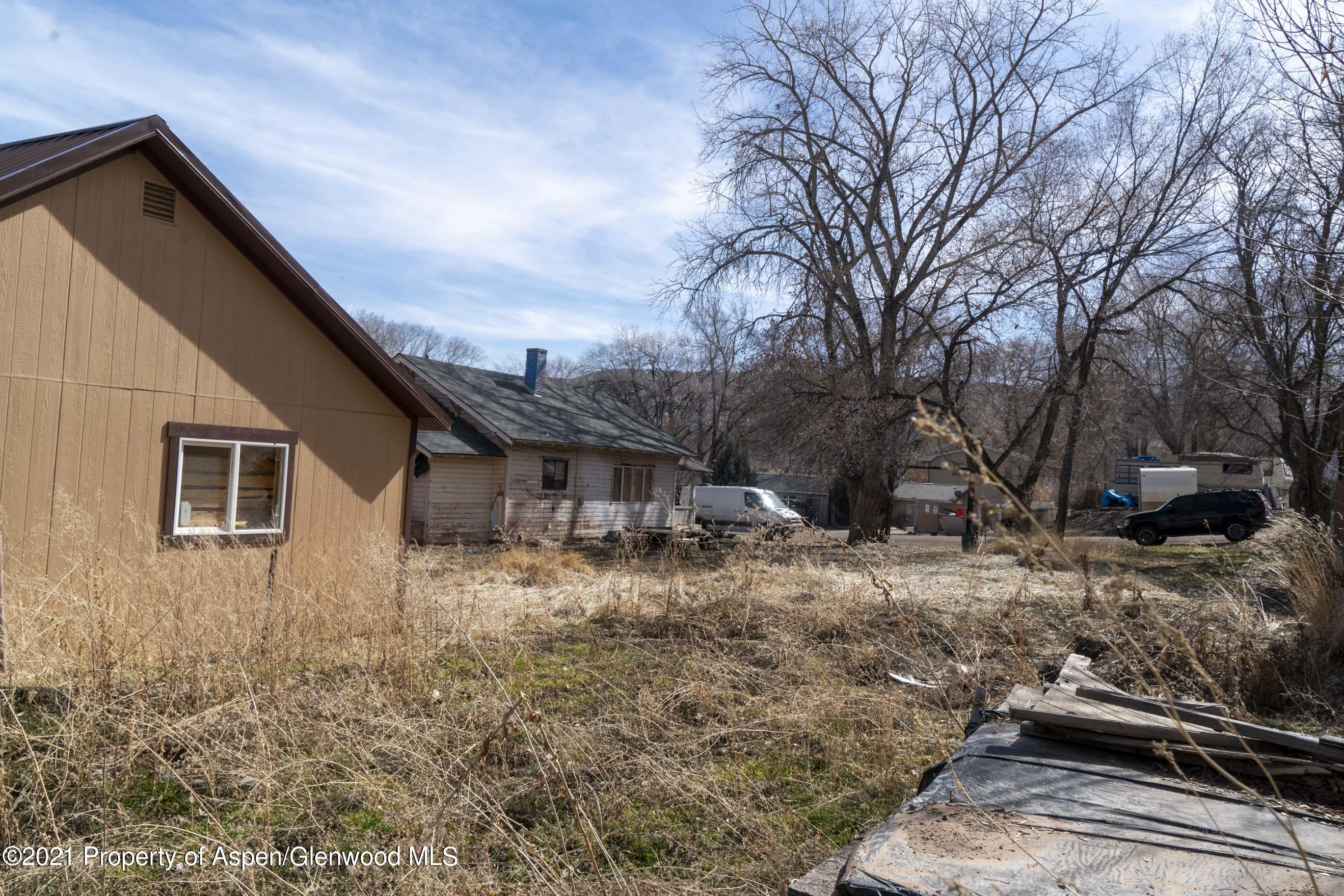 422 West 4th Street Rifle, CO 81650 - Photo 6 of 10 a backyard of a house with large trees