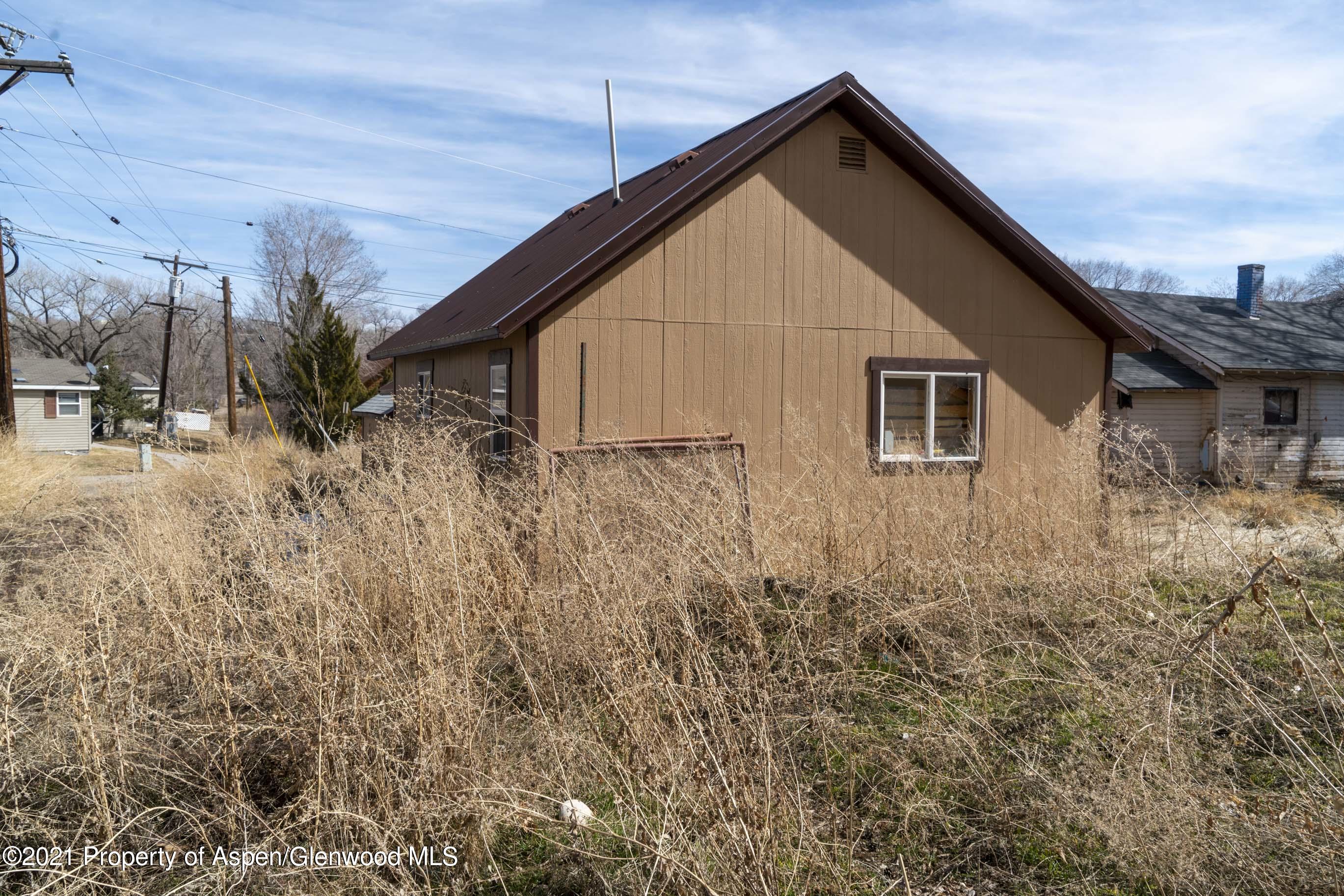422 West 4th Street Rifle, CO 81650 - Photo 7 of 10 a view of a house with a yard