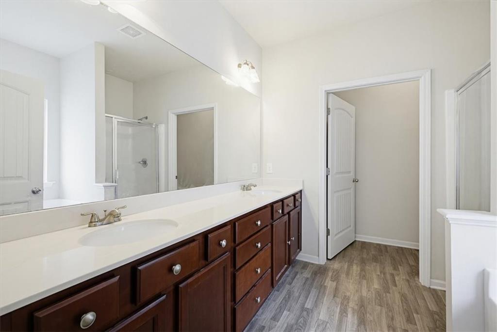 314 Boulder Run Hiram, GA 30141 - Photo 19 of 31 a bathroom with a double vanity sink and mirror
