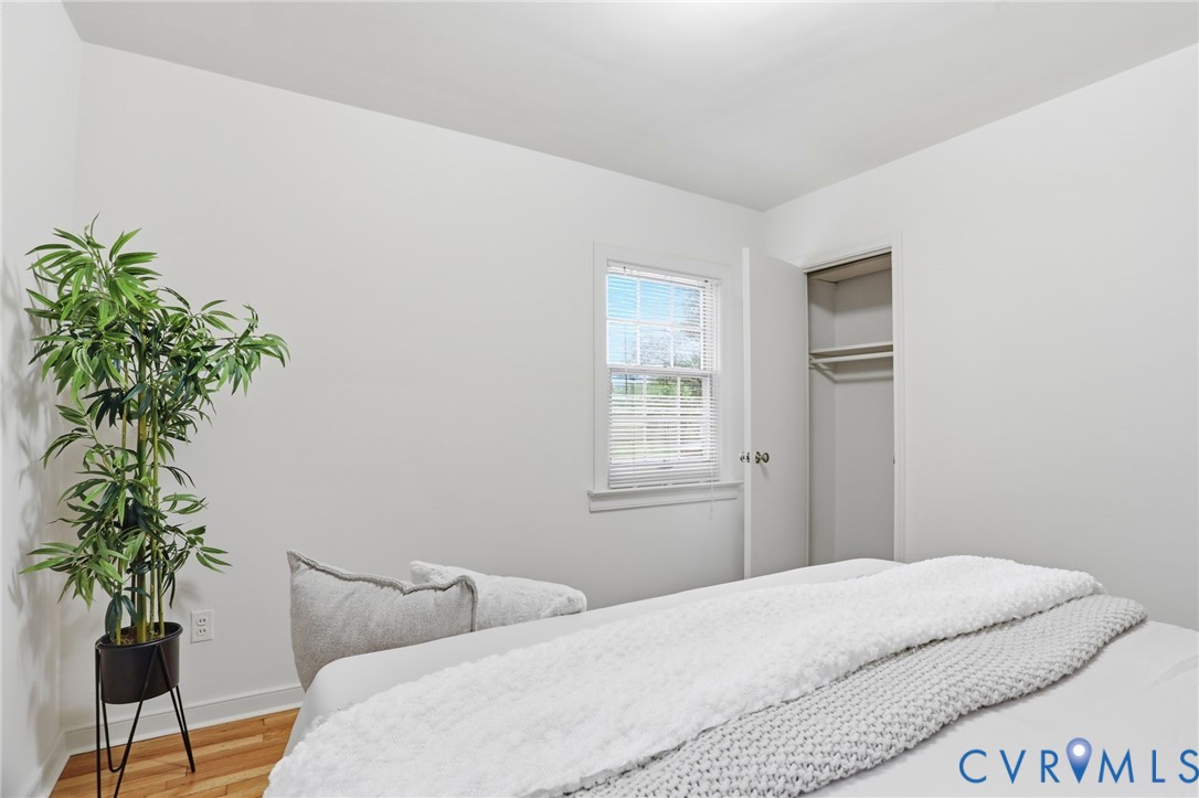 8955 Three Chopt Road Henrico, VA 23229 - Photo 32 of 40 Bedroom featuring wood-finish flooring, a double-h