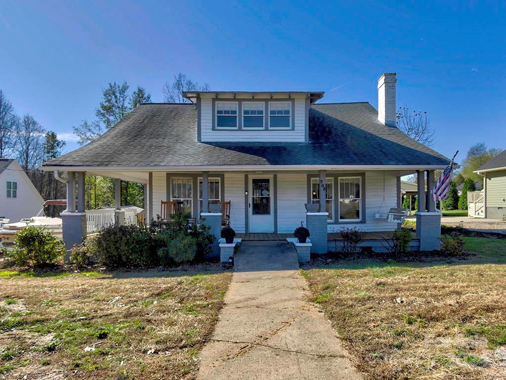 508 South Main Street Troutman, NC 28166 - Photo 1 of 38 a front view of a house with garden and porch