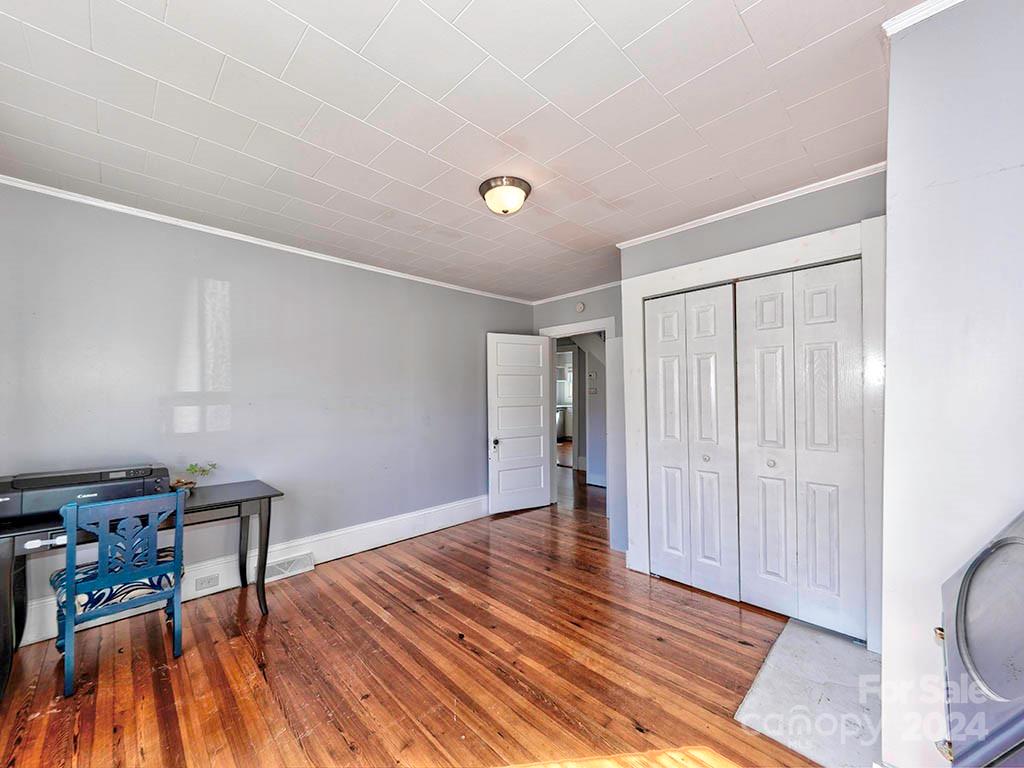 508 South Main Street Troutman, NC 28166 - Photo 15 of 38 a view of an empty room with wooden floor