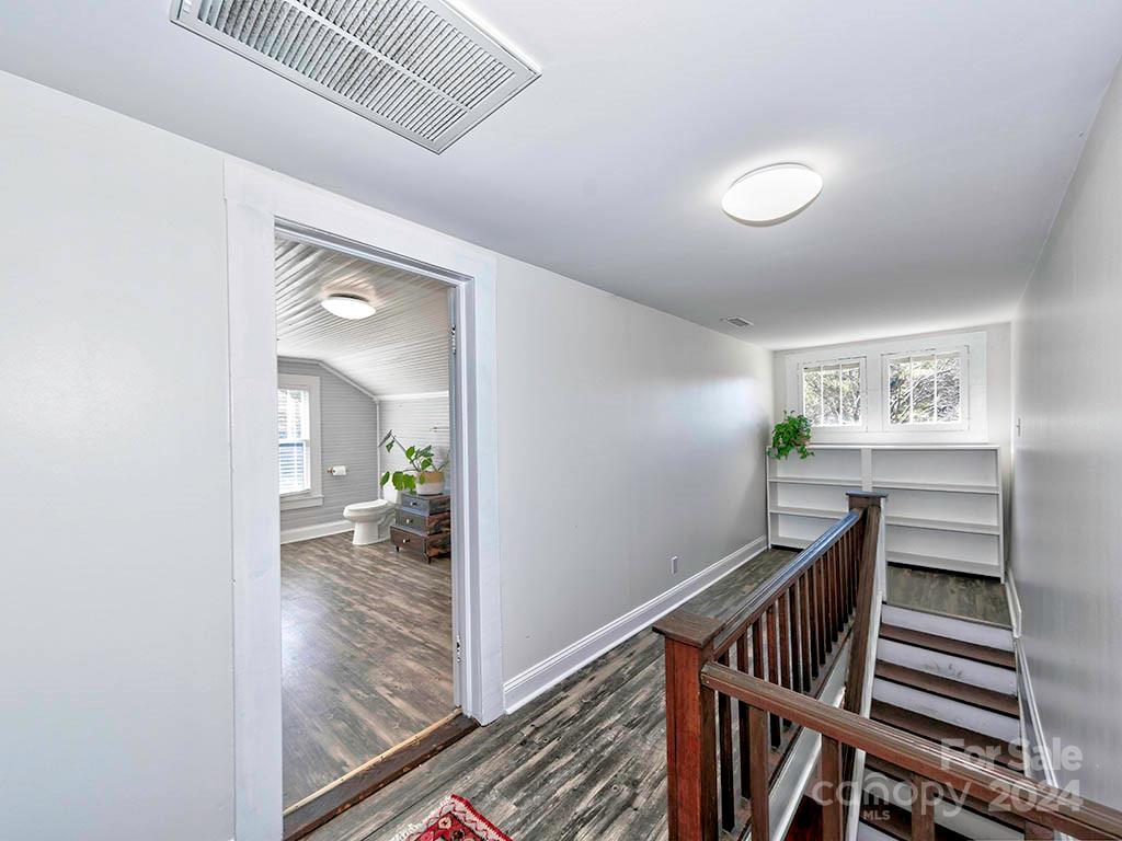 508 South Main Street Troutman, NC 28166 - Photo 20 of 38 a view of a hallway view with wooden floor and furniture