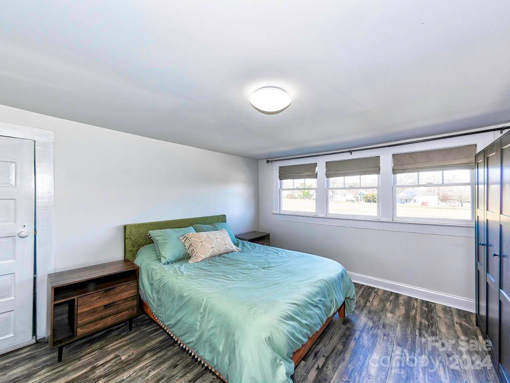 508 South Main Street Troutman, NC 28166 - Photo 23 of 38 a bedroom with a bed and wooden floor