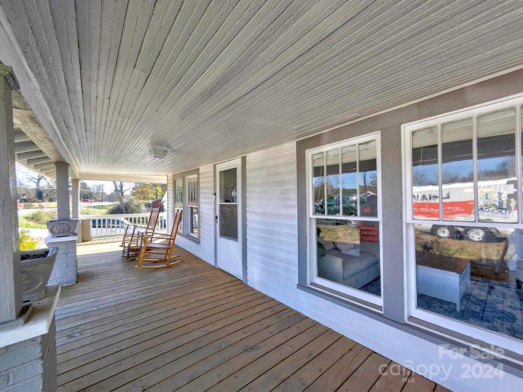 508 South Main Street Troutman, NC 28166 - Photo 3 of 38 a dining room with wooden floor and outdoor space
