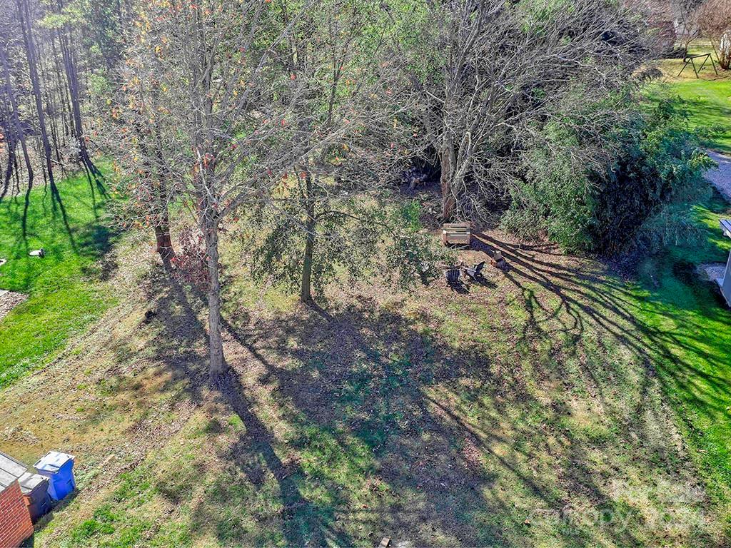 508 South Main Street Troutman, NC 28166 - Photo 37 of 38 a view of a yard with plants and large trees