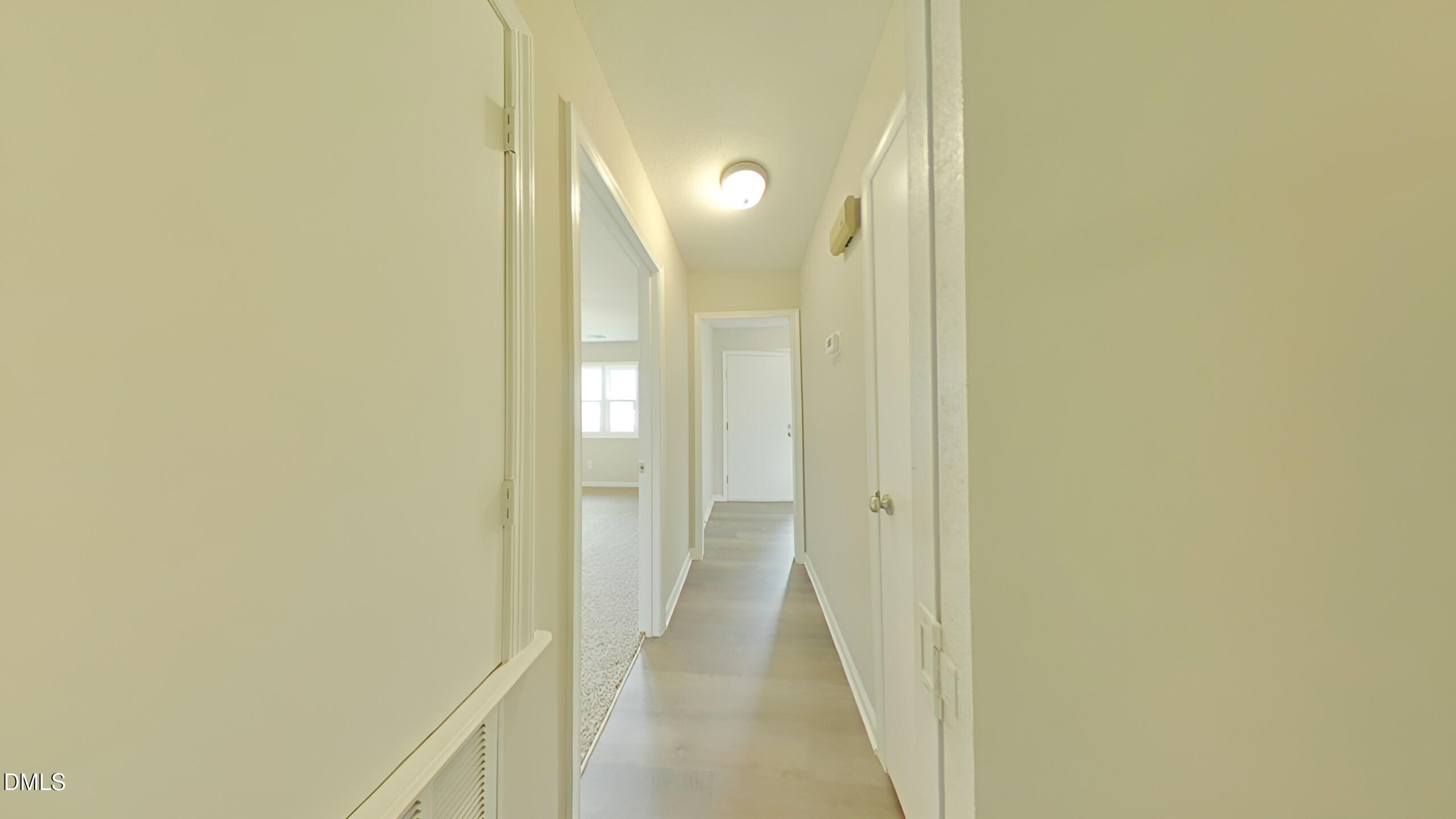 43 Redbud Court Durham, NC 27713 - Photo 3 of 15 a view of a bathroom from a hallway