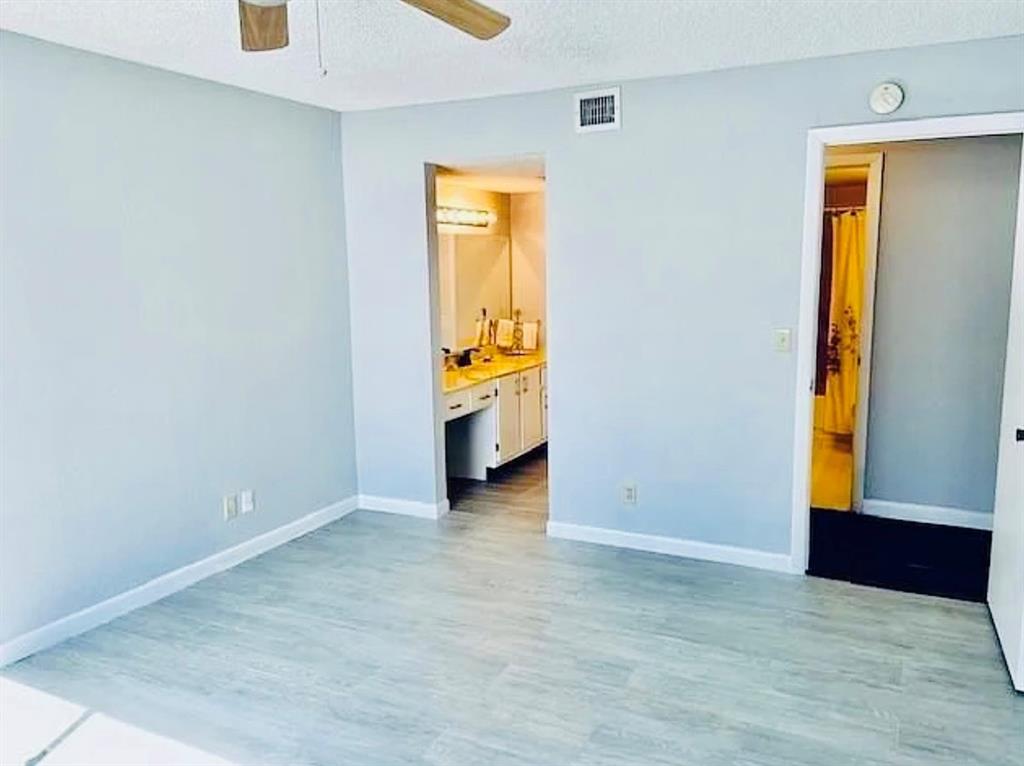 9733 Westview Drive, Unit 1314 Coral Springs, FL 33076 - Photo 7 of 15 a view of an empty room with a window