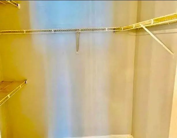 a view of a room with racks on the wall