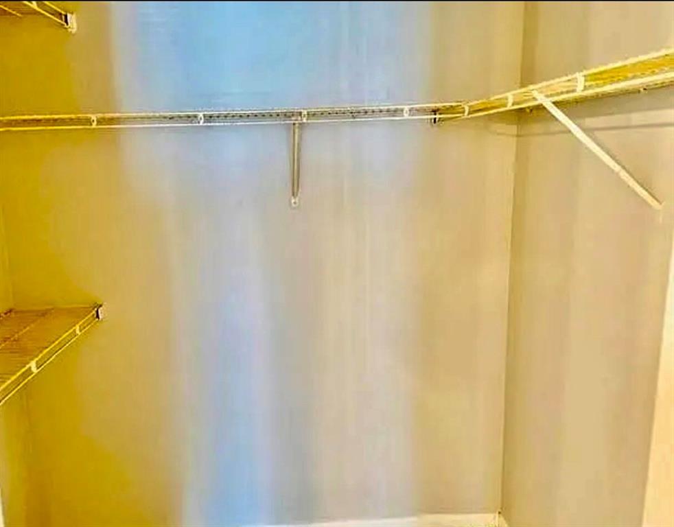 9733 Westview Drive, Unit 1314 Coral Springs, FL 33076 - Photo 9 of 15 a view of a room with racks on the wall