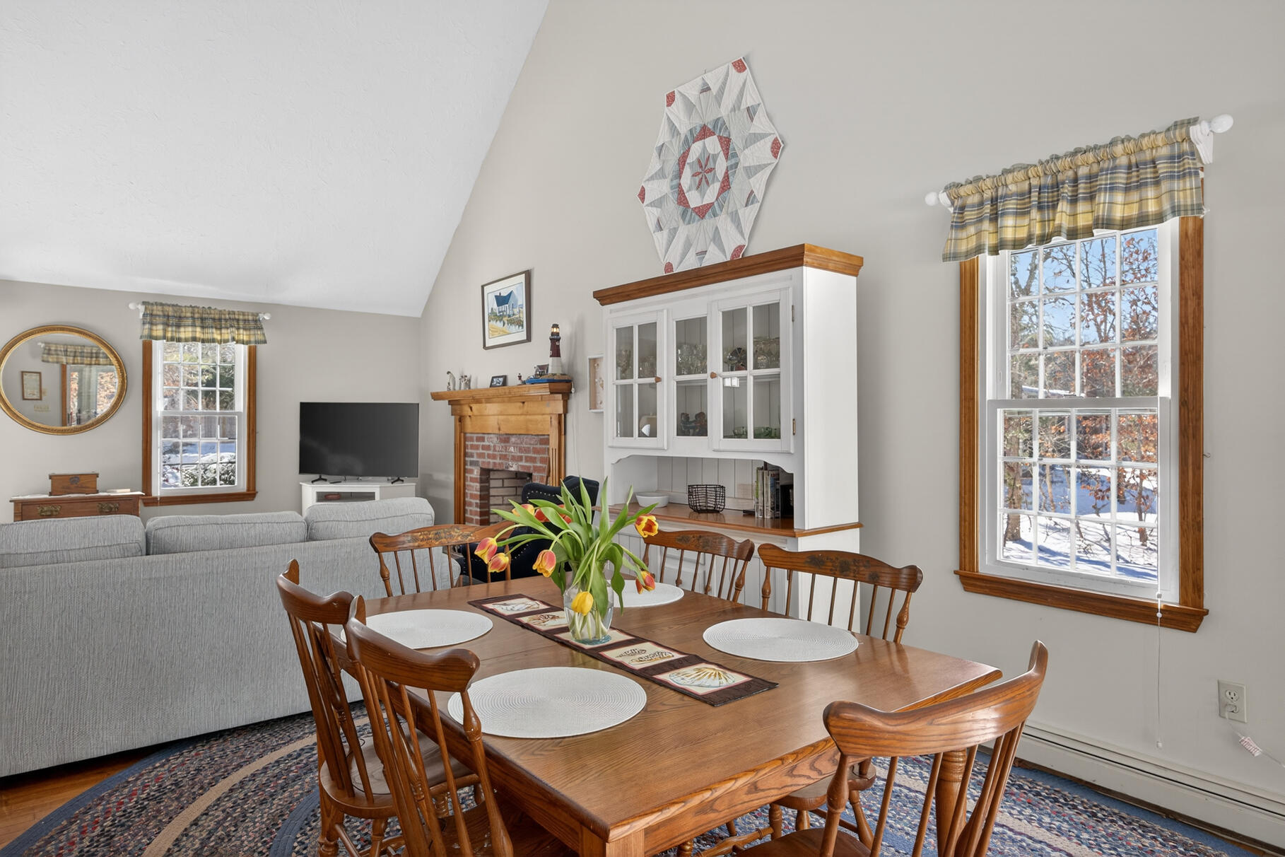 115 Wamsutta Road Eastham, MA 02642 - Photo 12 of 45 a view of a dining room with furniture window and wooden floor