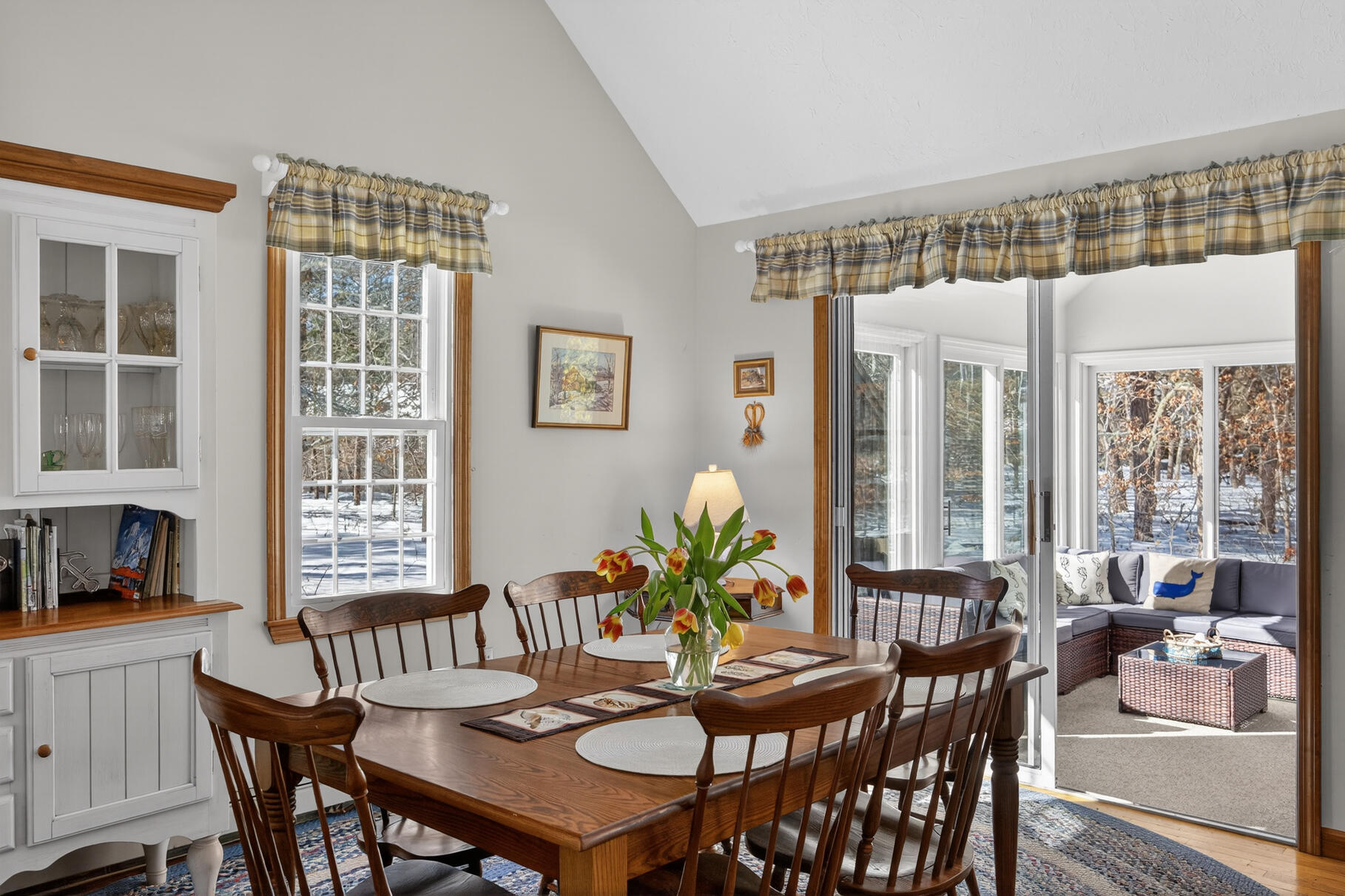 115 Wamsutta Road Eastham, MA 02642 - Photo 14 of 45 a view of a dining room with furniture window and wooden floor