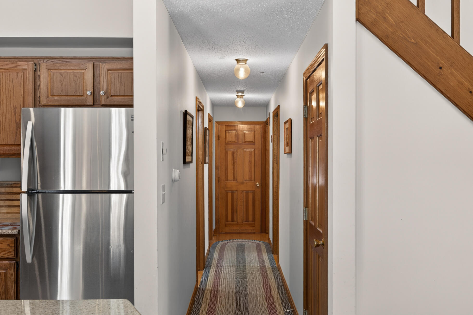 115 Wamsutta Road Eastham, MA 02642 - Photo 16 of 45 a view of a hallway with wooden floor and staircase