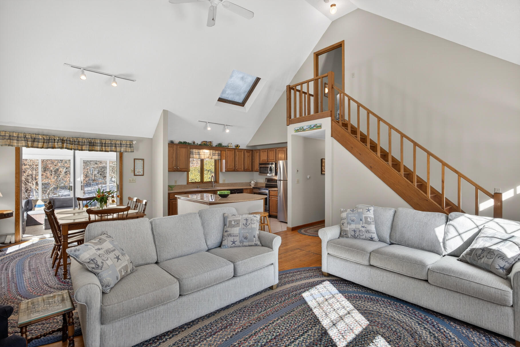 115 Wamsutta Road Eastham, MA 02642 - Photo 3 of 45 a living room with furniture and a view of kitchen